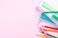 School stationery on pink background with copyspace Royalty Free Stock Photo