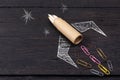 School stationery supplies and hand drawn rocket ship on dark background. Back to school concept. New idea and creativity Royalty Free Stock Photo