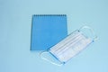 School stationery supplies, medical masks and hand gel sanitizer, keep your distance, open school, go back to school for the Royalty Free Stock Photo