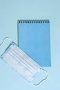 School stationery supplies, medical masks and hand gel sanitizer, keep your distance, open school, go back to school for the Royalty Free Stock Photo