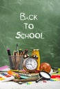 School statonery on green blackboard Royalty Free Stock Photo