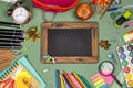 School statonery on green blackboard Royalty Free Stock Photo