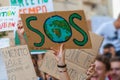 Fridays for future: students hands showing banners and boards