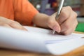 School Students hands taking exams, writing examination room with holding pencil on optical form of standardized test with answers Royalty Free Stock Photo