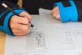 School Students hands taking exams, writing examination room wit Royalty Free Stock Photo