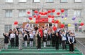 School students release balloons into the sky