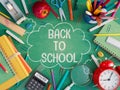 School stuff with back to school text on green chalkboard. Back to school concept background Royalty Free Stock Photo