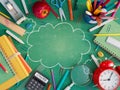 School stuff with copy space on green blackboard. Back to school concept background Royalty Free Stock Photo