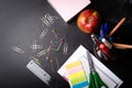 School supplies on the background of blackboard Royalty Free Stock Photo