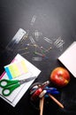 School supplies on the background of blackboard Royalty Free Stock Photo