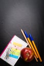 School supplies on the background of blackboard Royalty Free Stock Photo