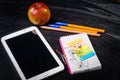 School supplies on the background of blackboard Royalty Free Stock Photo