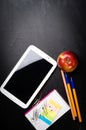 School supplies on the background of blackboard Royalty Free Stock Photo