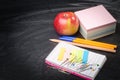 School supplies on the background of blackboard Royalty Free Stock Photo