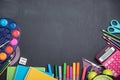 School supplies on the background of the blackboard ready for your design Royalty Free Stock Photo