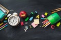 School supplies background flat lay on blackboard, back to school concept Royalty Free Stock Photo