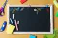 School supplies on black board background. Back to school concept Royalty Free Stock Photo