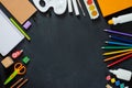 School supplies on black board background. Back to school concept. Frame, flatlay, copy space for text. Royalty Free Stock Photo