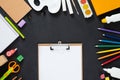 School supplies on black board background. Back to school concept. Frame, flatlay, copy space for text. Royalty Free Stock Photo