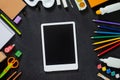 School supplies on black board background. Back to school concept. Frame, flatlay, copy space for text. Royalty Free Stock Photo