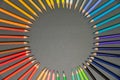 School supplies on black board background. Circle of pencils. Education, back to school concept with copy space Royalty Free Stock Photo