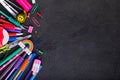 School supplies on black board background with copy space. Back to school Royalty Free Stock Photo