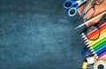 School supplies on black board background empty copy space. Royalty Free Stock Photo
