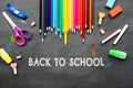 School supplies on blackboard background. Back to school concept