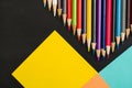 School supplies border on black chalkboard background. Top view photograph Royalty Free Stock Photo