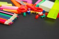 School supplies border on a chalkboard background Royalty Free Stock Photo
