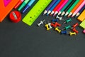 School supplies border on a chalkboard background Royalty Free Stock Photo