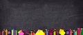 School supplies bottom border banner, top view on a chalkboard background with copy space. Back to school. Royalty Free Stock Photo