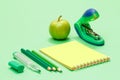 School supplies. Color pencils, notebook, apple and stapler Royalty Free Stock Photo