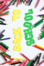 Back to school ,School supplies colored pencils in Fall scattered, isolated Royalty Free Stock Photo