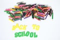 Back to school ,School supplies colored pencils in Fall scattered, isolated Royalty Free Stock Photo