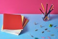 School supplies with colorful pencils and notebooks.