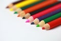 School supplies colored pencils in a row, isolated Royalty Free Stock Photo