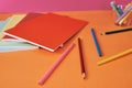 School supplies with colorful pencils and notebooks.