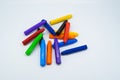 School supplies, colourful crayons stationery on white background Royalty Free Stock Photo