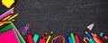 School supplies corner border banner, top view on a chalkboard background with copy space. Back to school. Royalty Free Stock Photo