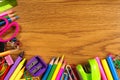 School supplies corner border on wood desk