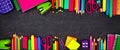 School supplies double border banner, top view on a chalkboard background with copy space. Back to school.