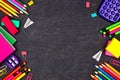 School supplies double side border, top view on a chalkboard background with copy space. Back to school. Royalty Free Stock Photo