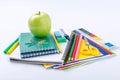 School supplies with green apple Royalty Free Stock Photo