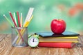 School supplies on green empty space background. Royalty Free Stock Photo