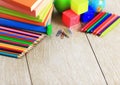 School supplies lying on the wooden floor