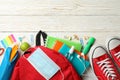 School supplies medical mask and sanitizer on wooden background Royalty Free Stock Photo