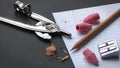 School Supplies - Pencil, Pencil Sharpener, Pink Erasers and Compass on Notepad Paper Royalty Free Stock Photo