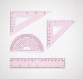 School supplies. Set of pink plastic transparent plastic measuring tools Royalty Free Stock Photo