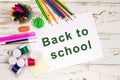 School supplies on a white wooden background with an empty space for inscriptions. Royalty Free Stock Photo